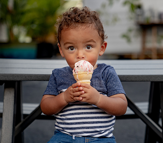 Kid enoying an ice cream cone